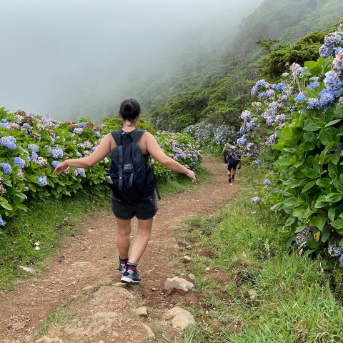 a person standing on a dirt path