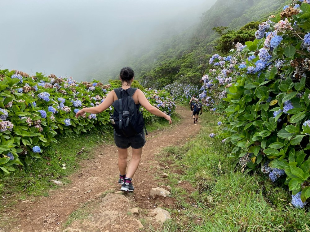 a person standing on a dirt path