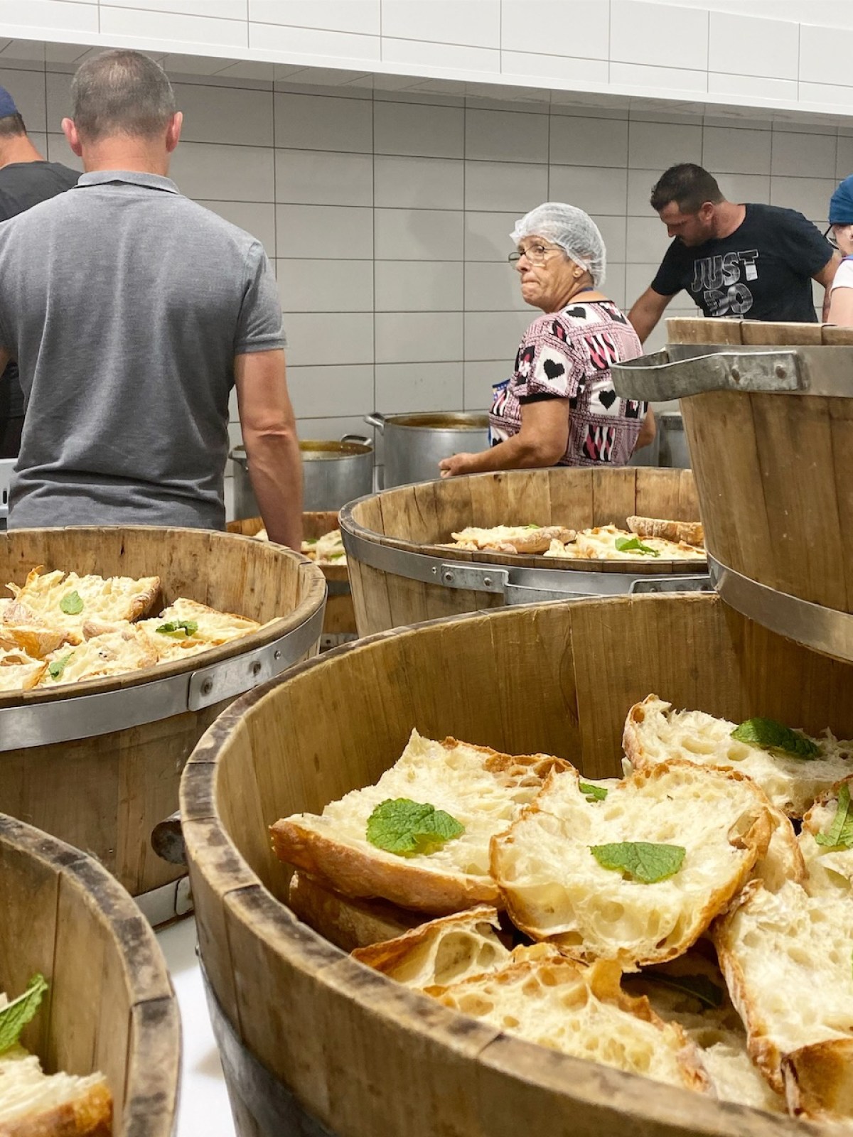 a group of people in a communal kitchen
