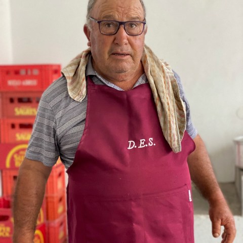 a man wearing a pink shirt