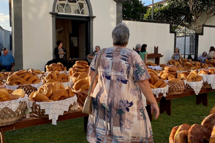 a group of people that are standing in the grass