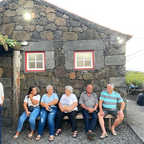 a group of people standing in front of a building