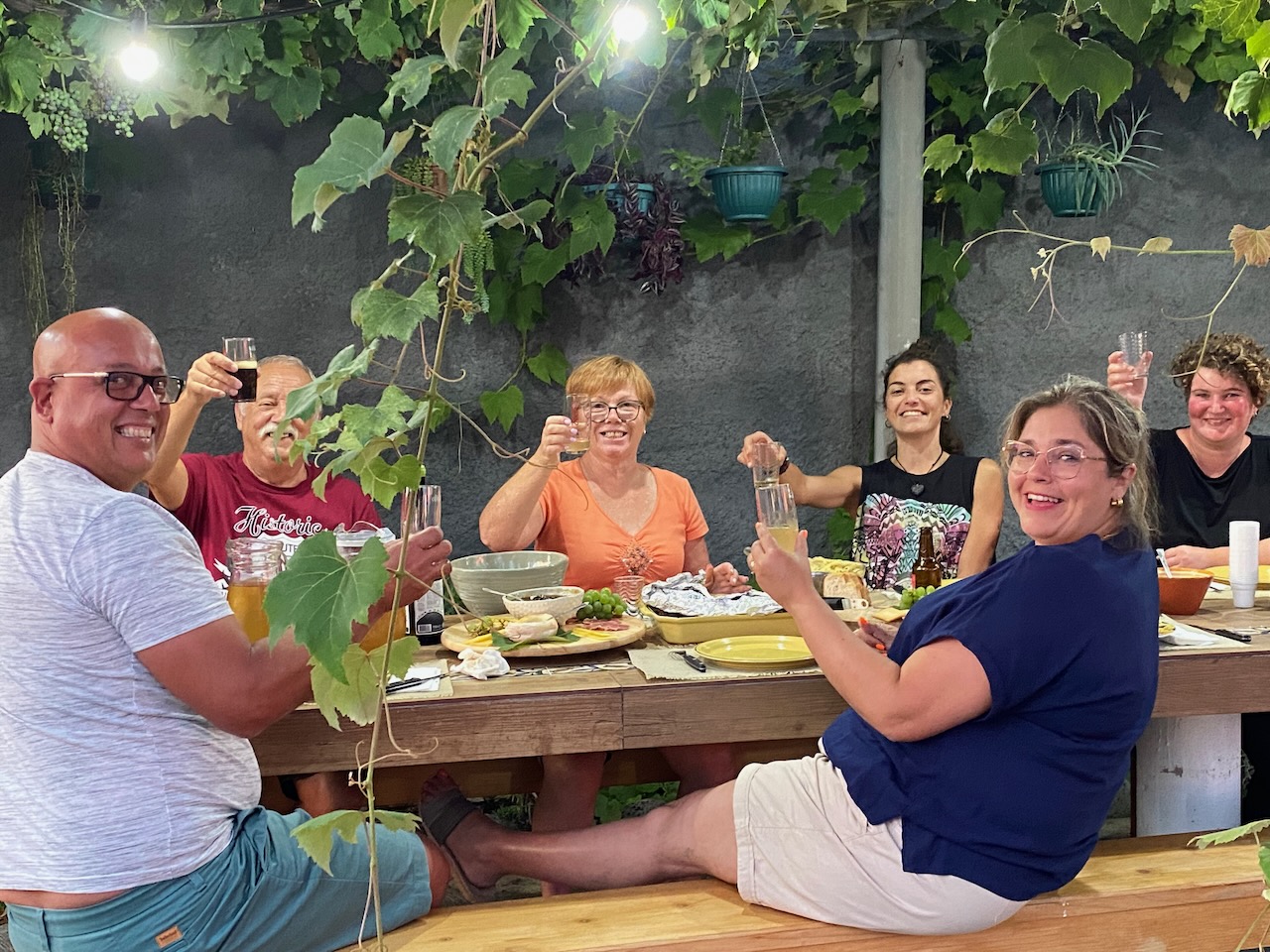 a group of people sitting at a table eating food