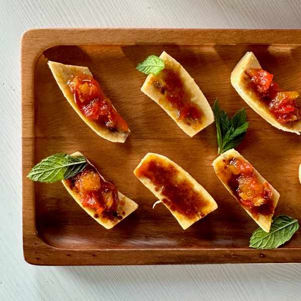 a bunch of food sitting on top of a wooden cutting board