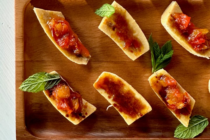 a bunch of food sitting on top of a wooden cutting board