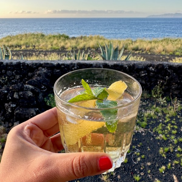 a hand holding a glass of water