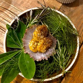 a plate of food sitting on top of a wooden table