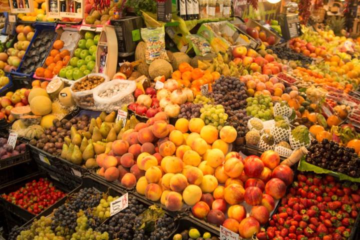 a variety of fresh fruit and vegetables on display in a store