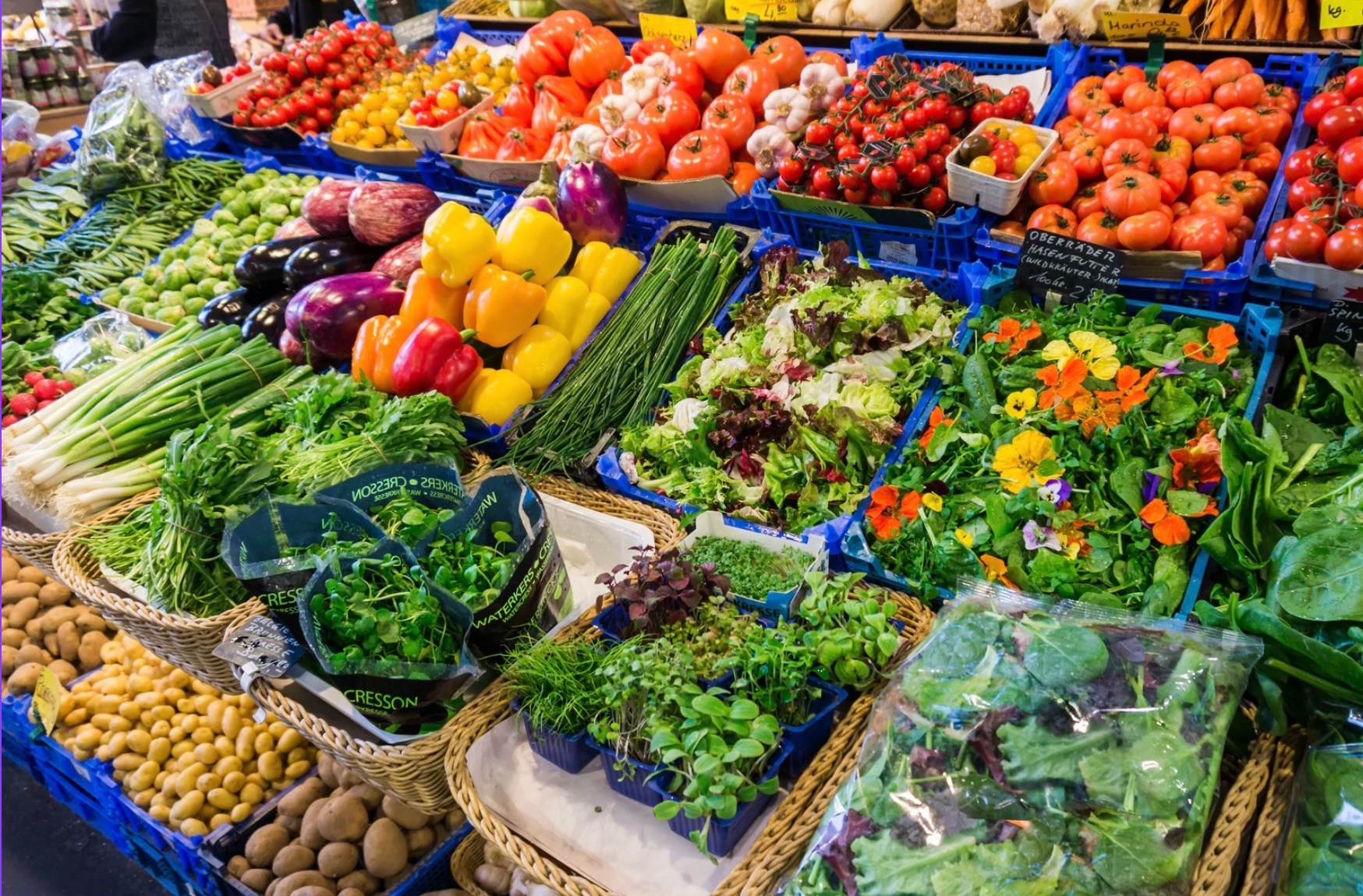 Market stall with a variety of colorful fruits and vegetables.