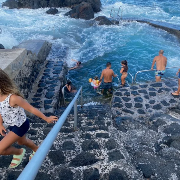 a group of people on a rocky beach
