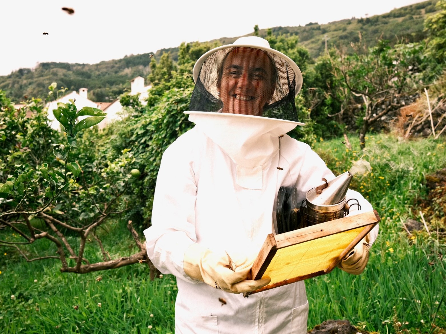 a person sitting on top of a grass covered field