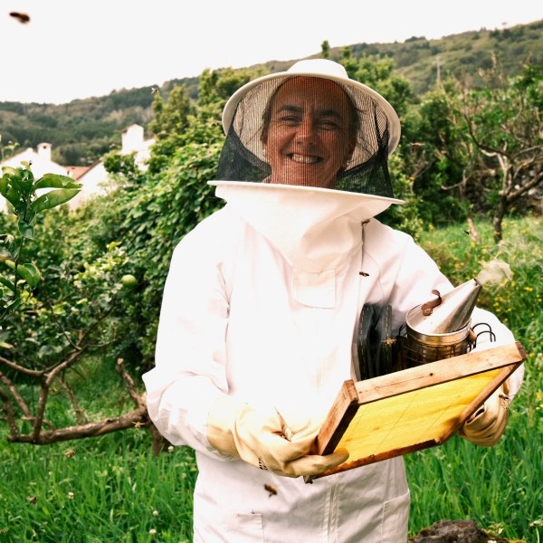 a person sitting on top of a grass covered field